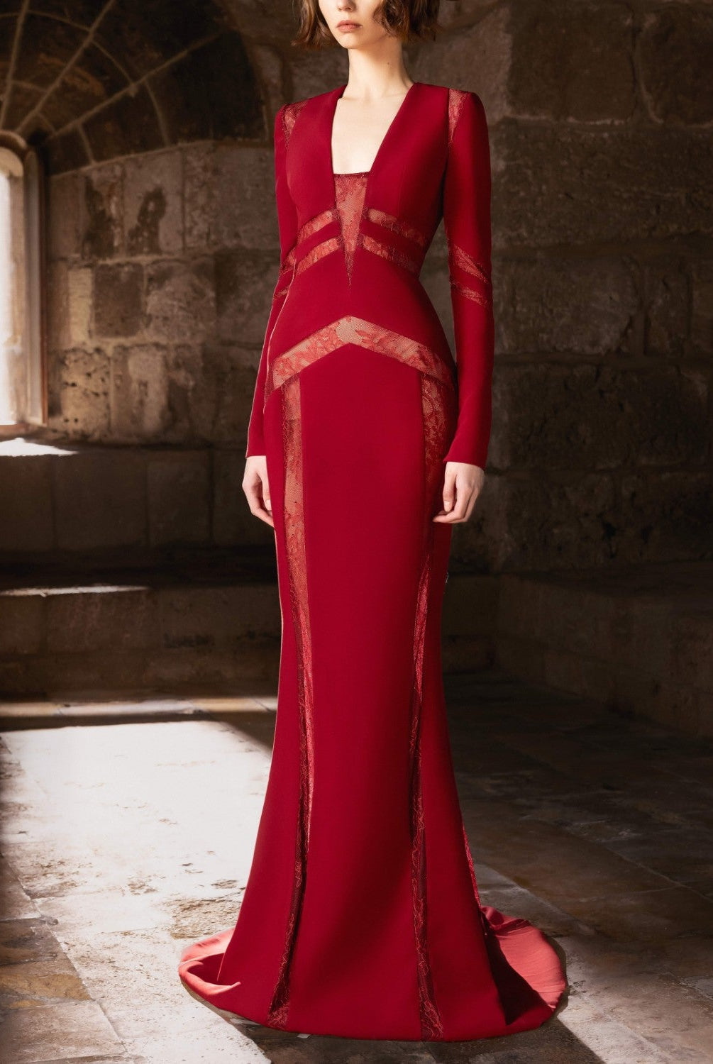 A sculpted mermaid gown in deep burgundy.