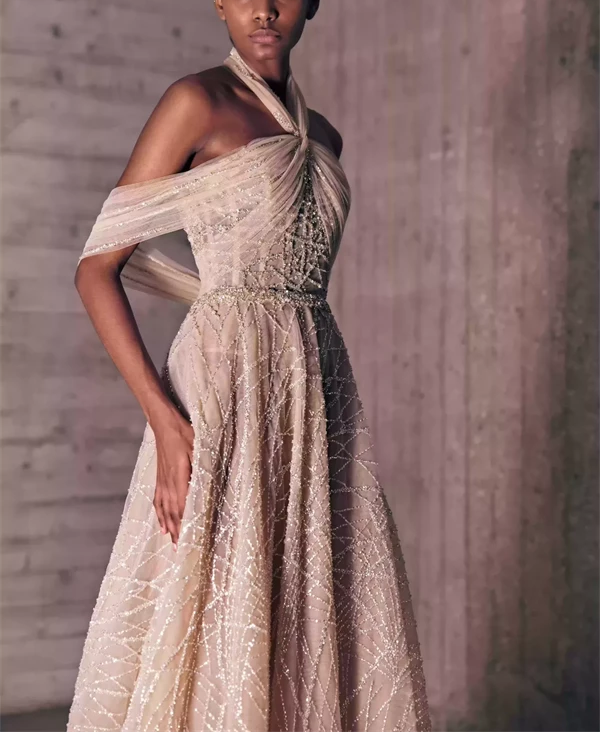 Nude Shaded Dress With Gold And Silver Sprinkled Embroideries.
